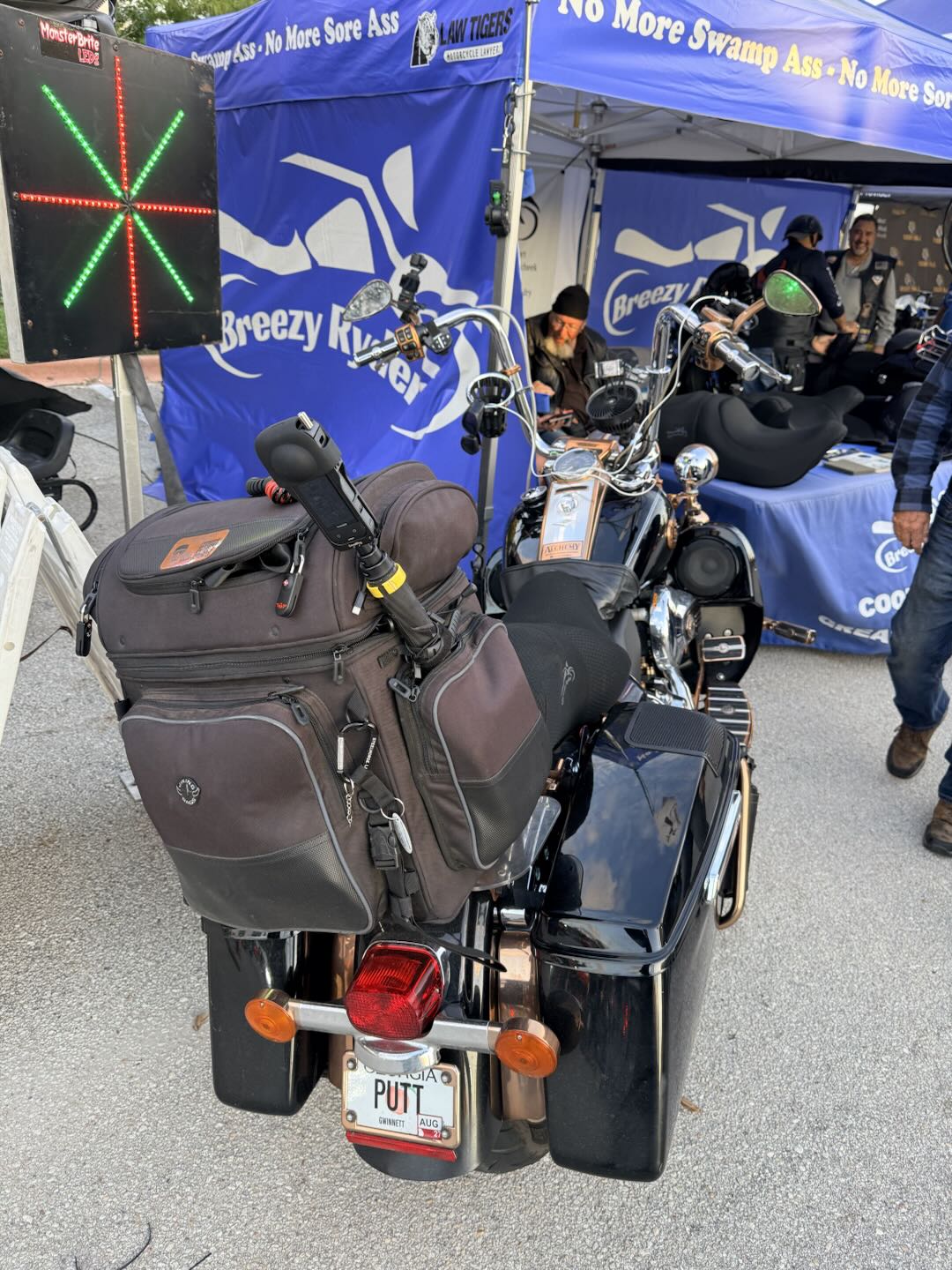 Motorcycle with an Insta360 X Series camera poking out of the baggage.